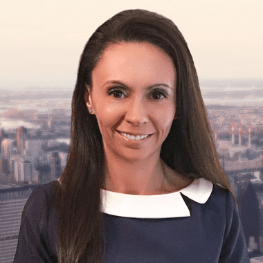 A woman in a blue dress standing in front of a cityscape, seeking guidance from Cambridge Child Custody Lawyers.